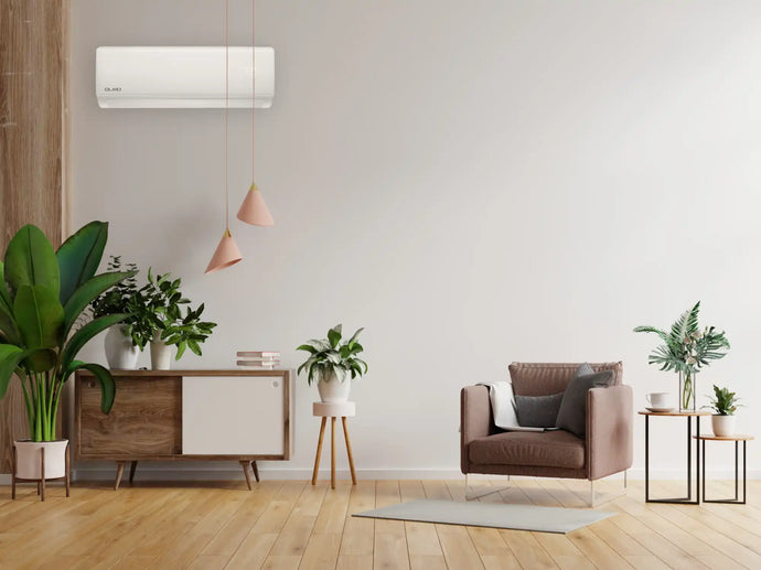 White wall-mounted air conditioner with sleek design and modern aesthetic.