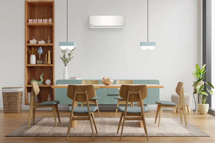 White wall-mounted air conditioner with sleek modern design and minimalist aesthetic.