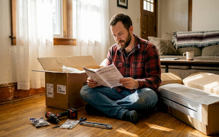 Homeowner reads instructions for mini split installation